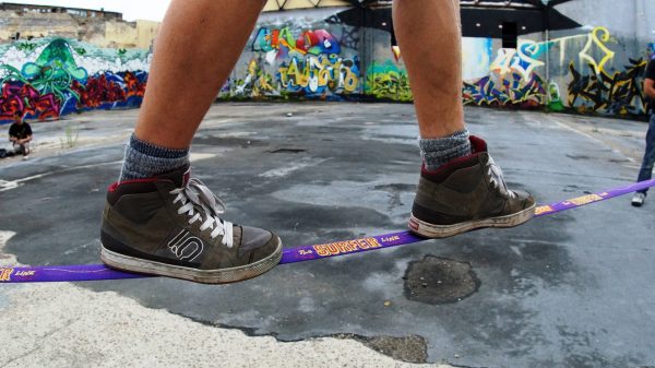 slacklining-with-shoes-sneakers-new-zealand-Gibbon-slackline-purple-surfer-Line-30-meter